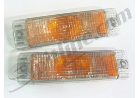 Coppia plastiche (a due fori di fissaggio) fanali frecce anteriori fumé - arancio Volkswagen Golf (-'89), Polo (→ '90)