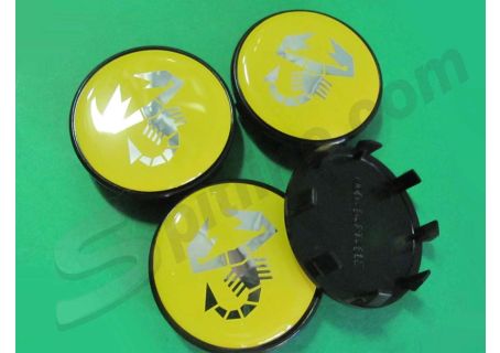 Serie 4 borchiette coprimozzo fondo giallo (diam. esterno mm 50 circa) con logo Abarth