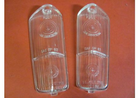 Coppia plastiche originali Carello (mod. ad un foro superiore e linguetta d'incastro inferiore) per fanali anteriori Alfa Romeo Giulia Sprint GT