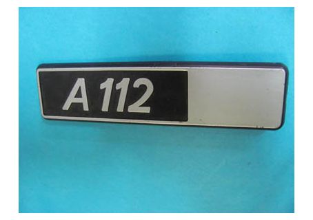 Scritta in plastica posteriore destra Autobianchi A 112 (fondo nero liscio)