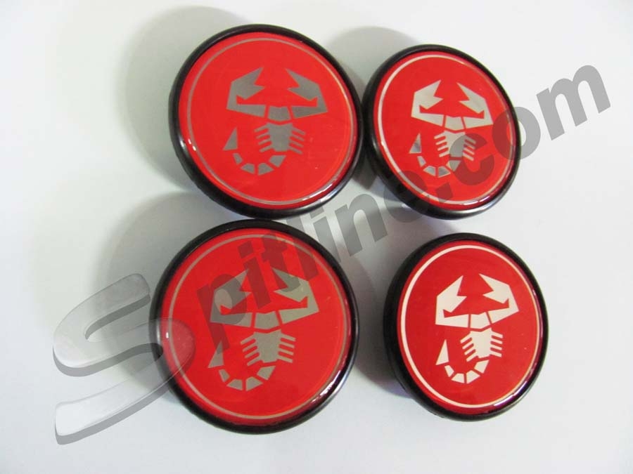 Serie 4 borchiette coprimozzo fondo rosso (diam. esterno mm 55) per cerchi A112 Abarth ecc.